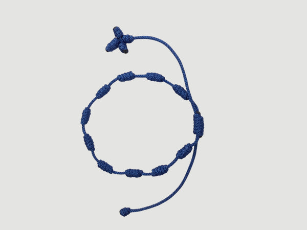 Dark Blue adjustable knotted decade cord bracelet with woven cross