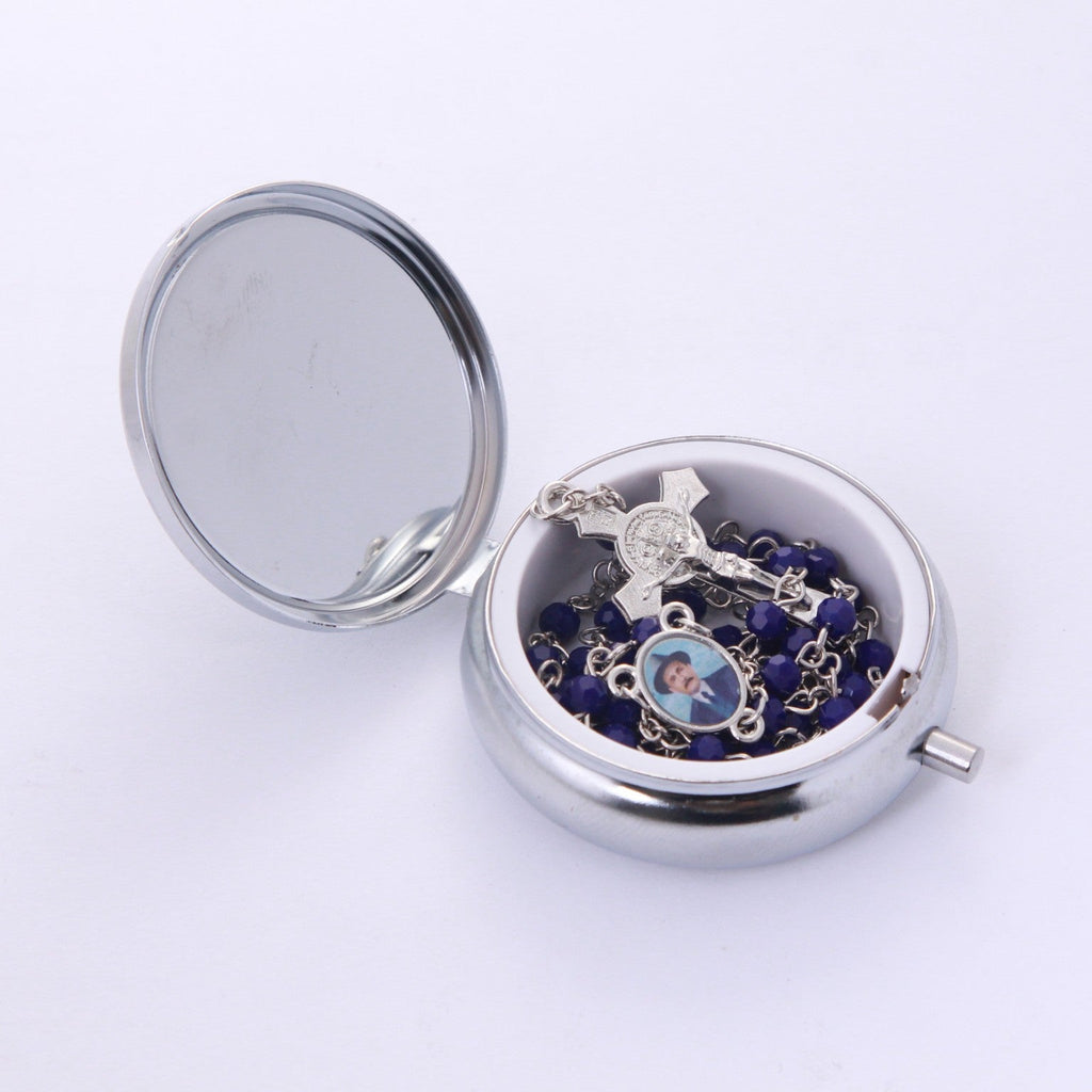 Blue crystal Dr. José Gregorio Hernández rosary inside open metal keepsake box