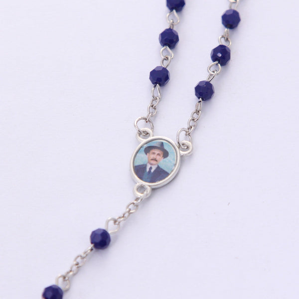 Gifts and Faith blue crystal rosary featuring a silver-tone centerpiece of Dr. José Gregorio Hernández