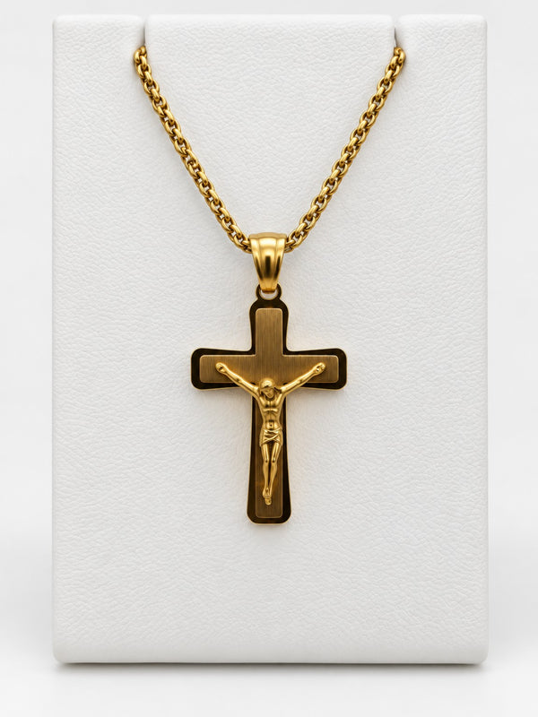A gold-tone crucifix with a brushed-look center, polished border and a raised figure of Jesus.