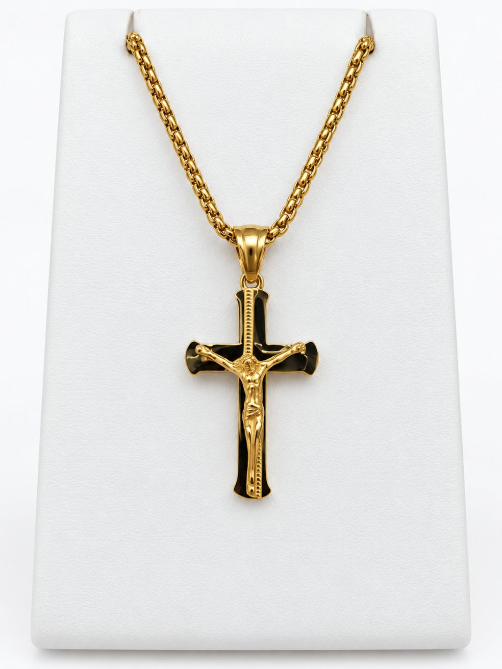 A polished gold-tone crucifix with flared cross ends and a raised figure of Jesus.