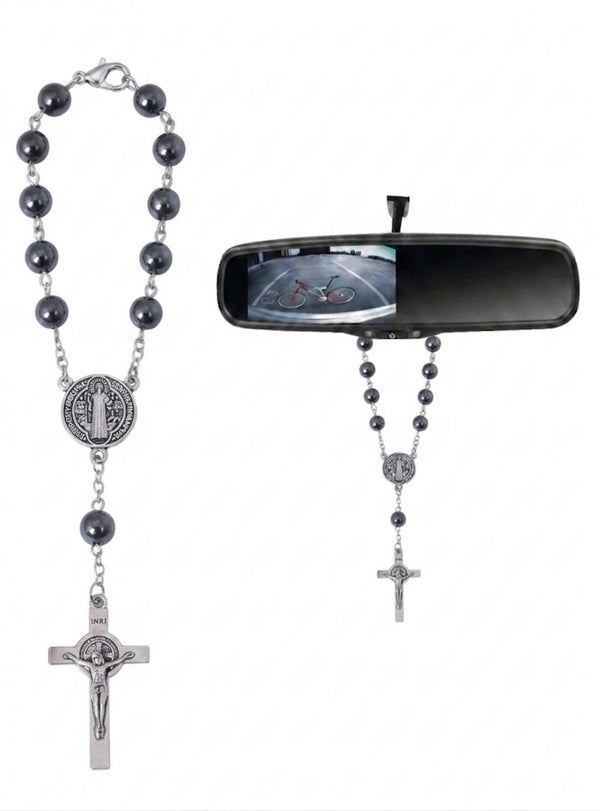 Hematite Saint Benedict auto rosary hanging from a car rearview mirror