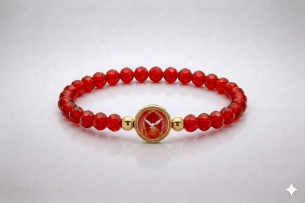 Holy Spirit red crystal elastic bracelet with gold-tone centerpiece, front view