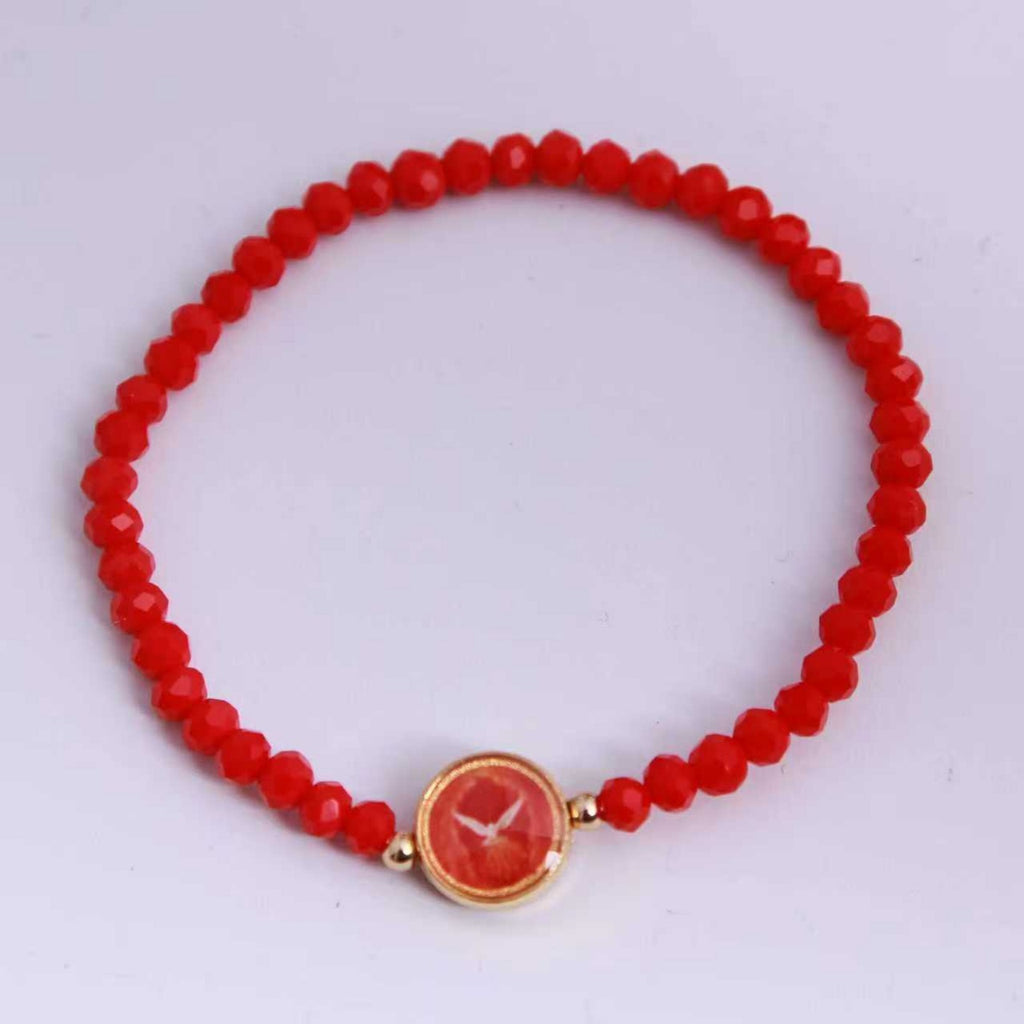 Espíritu Santo: pulsera elástica de cristal rojo, vista superior