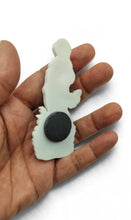 Back of Virgin Mary refrigerator magnet showing magnet