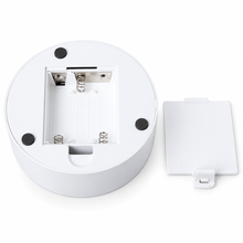 LED night light battery compartment on white background