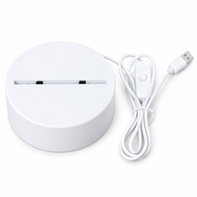 White LED night light base with USB cable on white background