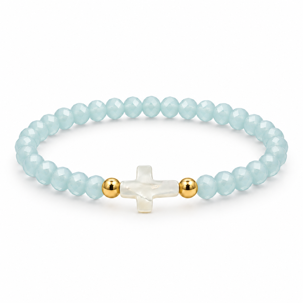 pale aqua baby blue crystal stretch bracelet with mother-of-pearl cross and two gold-tone spacers on white