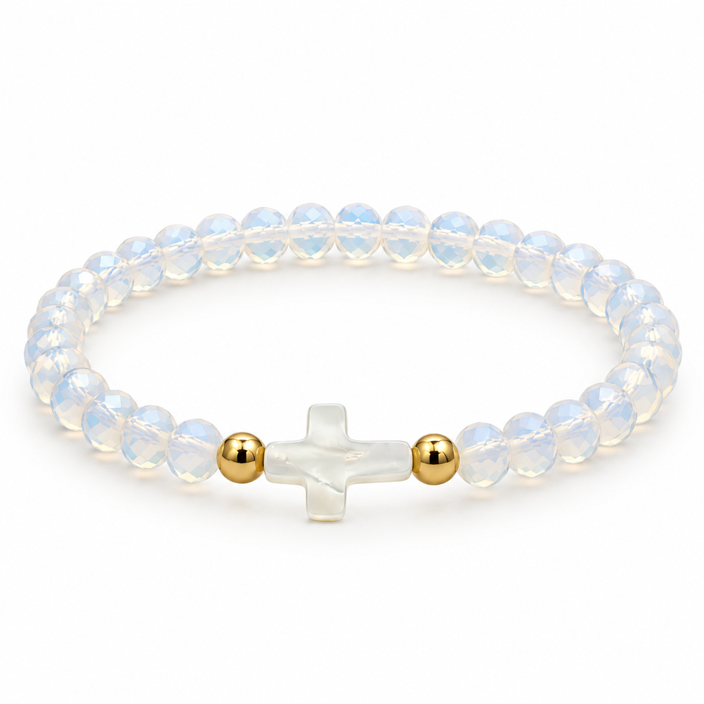 opalescent white stretch bracelet with mother-of-pearl cross and two gold-tone spacers on white