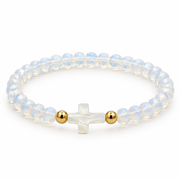 opalescent white stretch bracelet with mother-of-pearl cross and two gold-tone spacers on white
