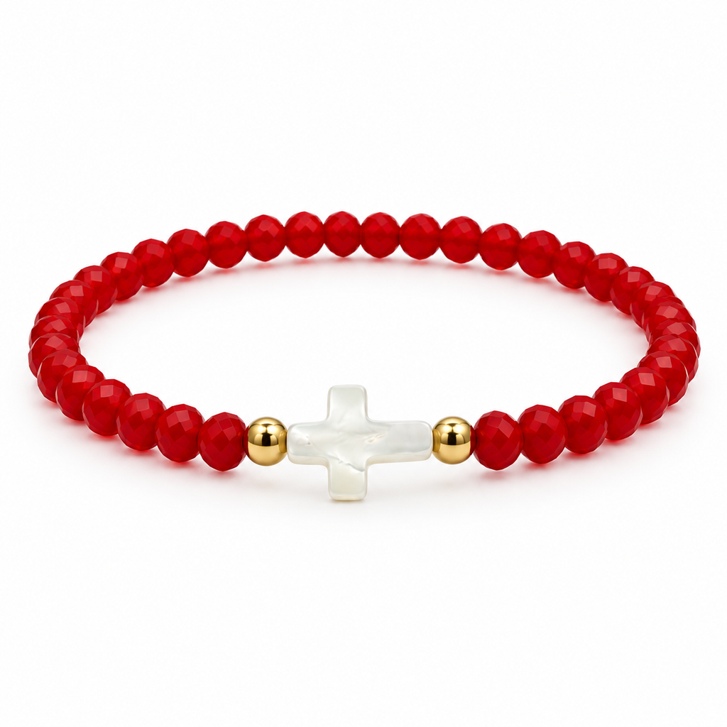 red stretch bracelet with mother-of-pearl cross and two gold-tone spacers on white