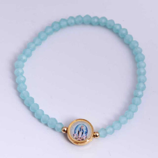 Virgen Milagrosa: pulsera elástica de cristal azul claro, vista superior