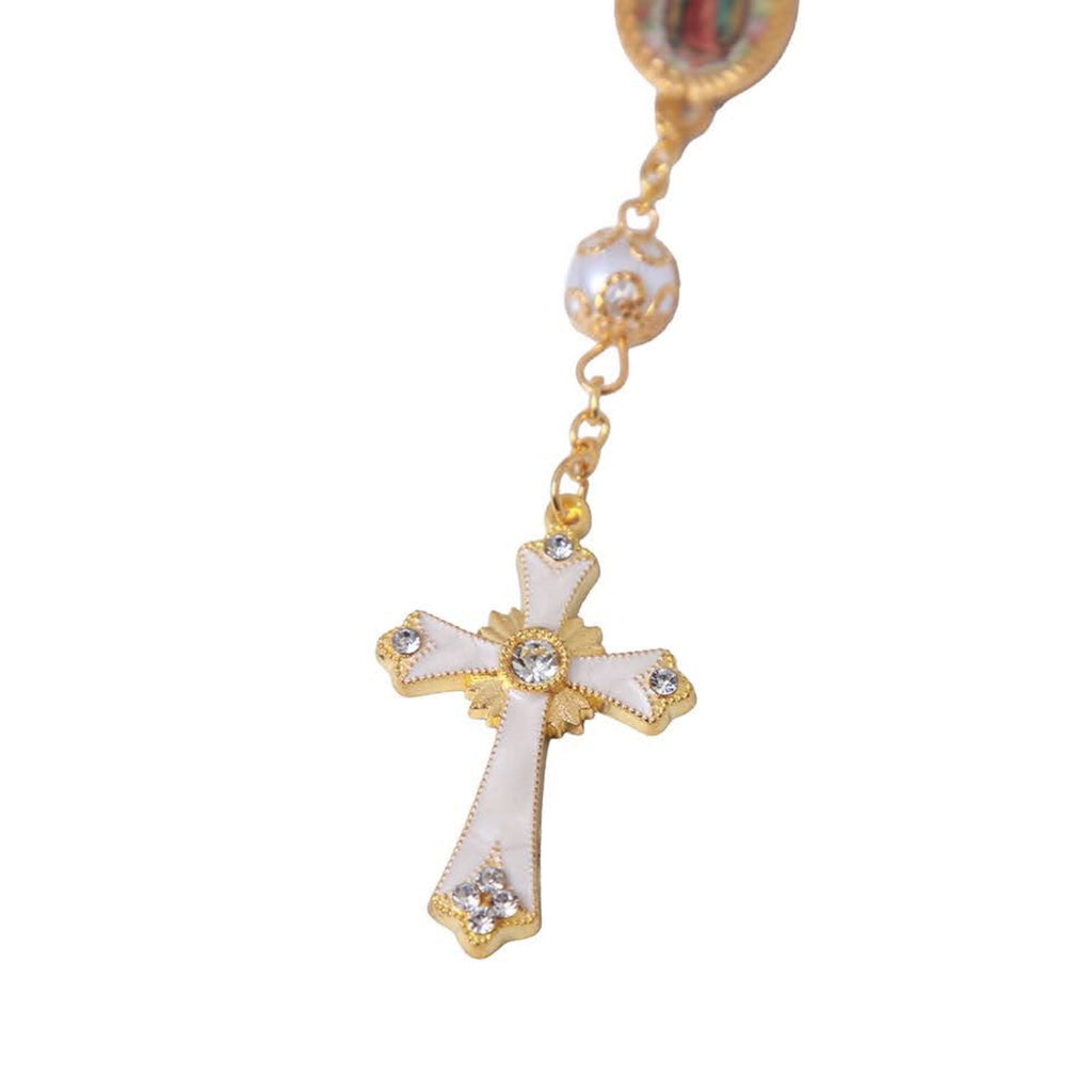 White and gold-tone decorative cross close-up