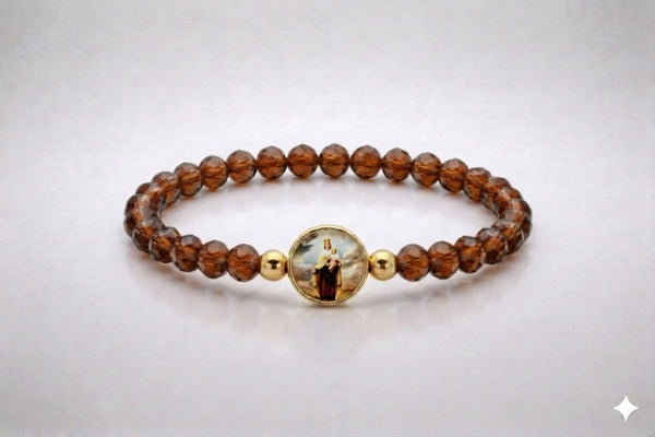 Our Lady of Mount Carmel brown crystal elastic bracelet with gold-tone centerpiece, front view