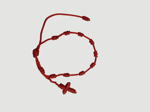 Red adjustable knotted decade cord bracelet with woven cross