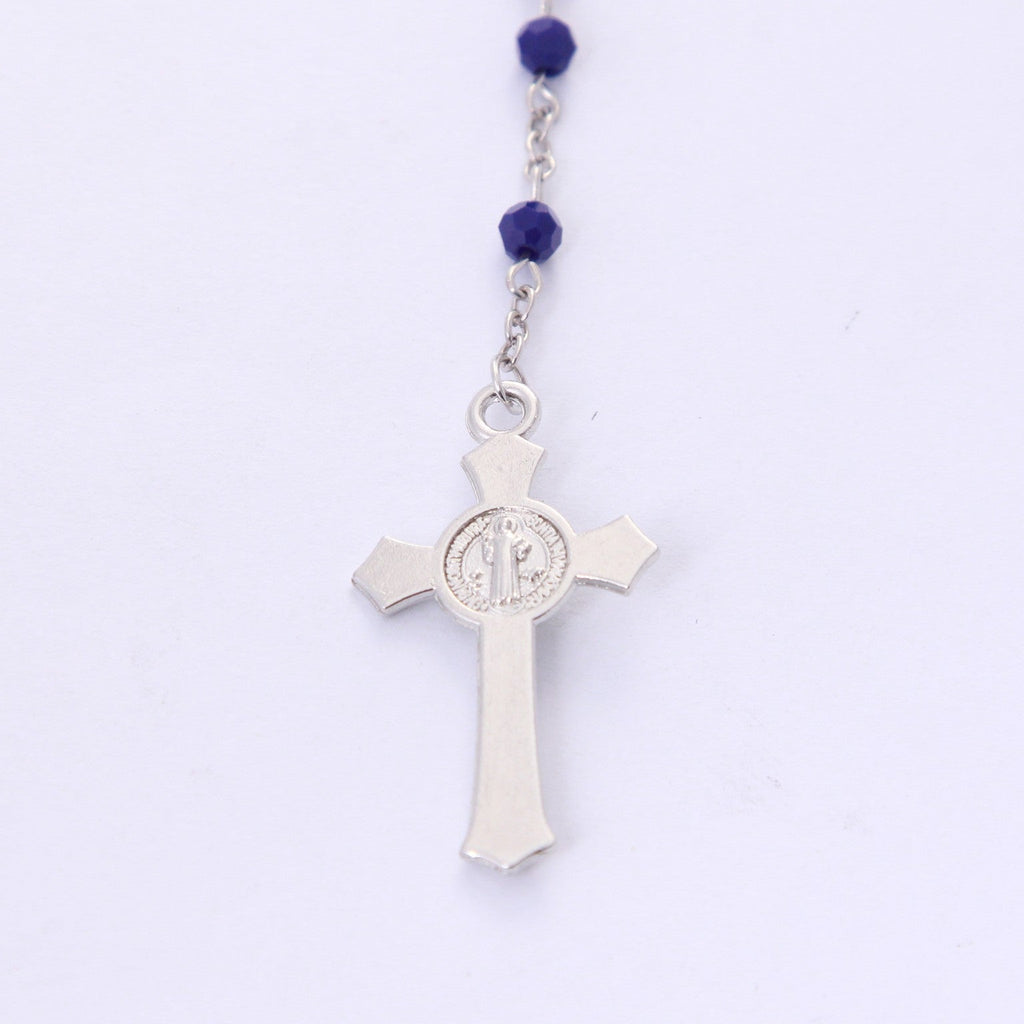 Back of Saint Benedict crucifix on blue crystal devotional rosary