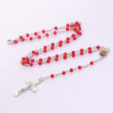 Back of Saint Benedict crucifix on red crystal devotional rosary