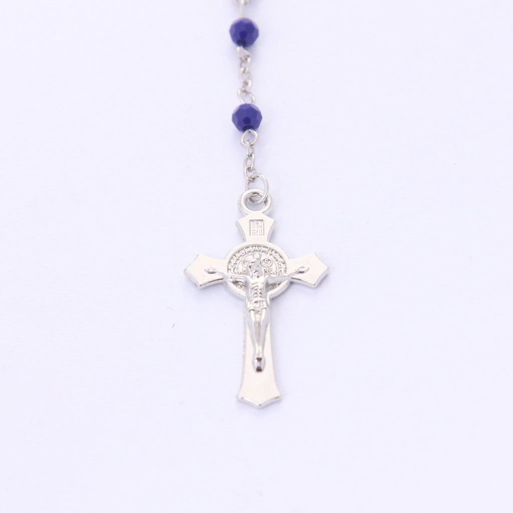 Front of Saint Benedict crucifix on blue crystal devotional rosary