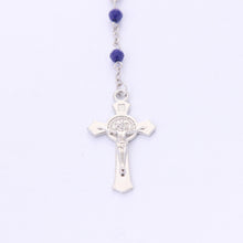 Front of Saint Benedict crucifix on blue crystal devotional rosary