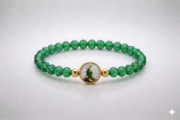Saint Jude green crystal stretch bracelet with gold-tone accents, front view
