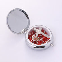 Red crystal Saint Michael the Archangel rosary inside open metal keepsake box