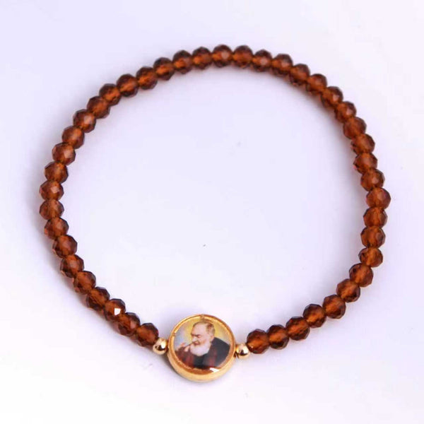 San Padre Pío: pulsera elástica de cristal marrón, vista superior