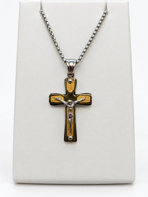 A two-tone crucifix with gold-tone decorative panels, silver-tone Jesus figure and silver-tone chain.